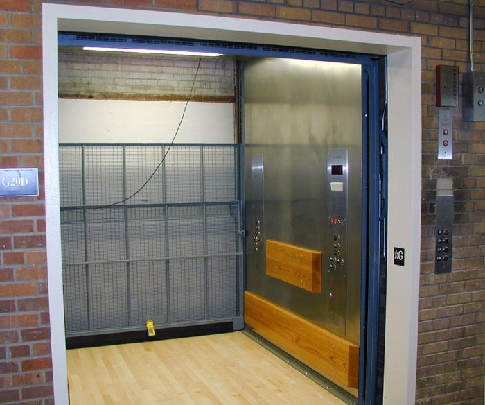 A freight elevator has a weight limit of 2 tons